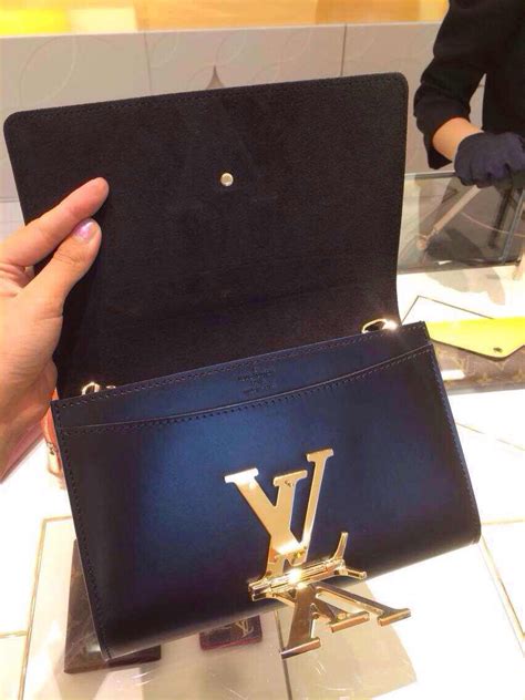 louis vuitton louise clutch review